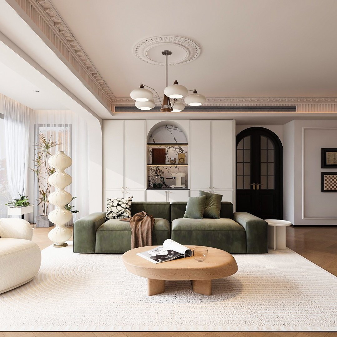 Modern French living room with an olive green velvet sofa and floor-to-ceiling custom cabinetry
