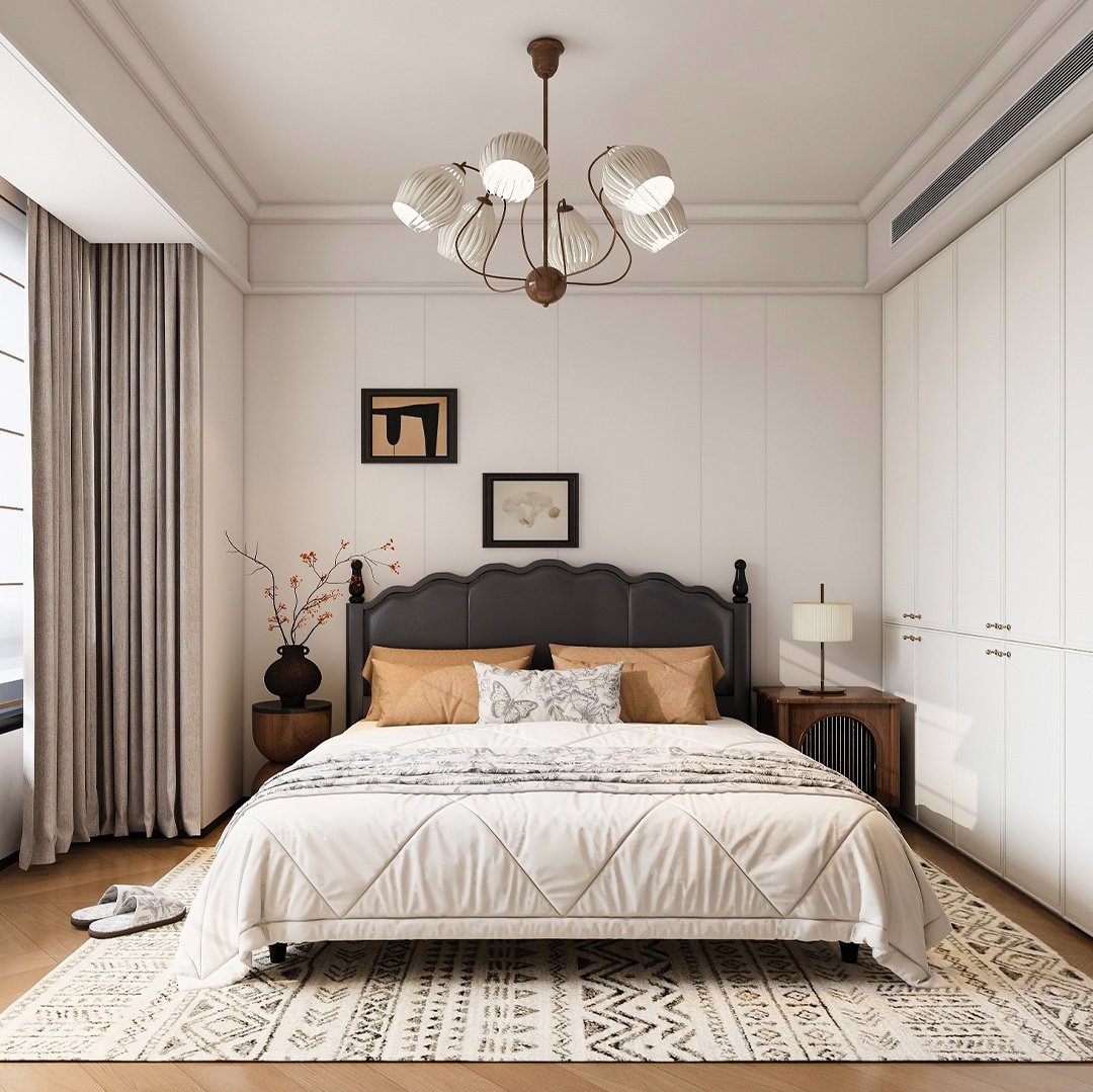 Dark upholstered bed and a floor-to-ceiling white custom closet with handle-less doors